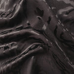 Wave fold of second zebra metallic jacquard colourway showing pattern shimmer.