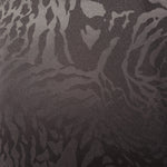 Wide view of second zebra metallic motif woven jacquard fabric for garment panels.