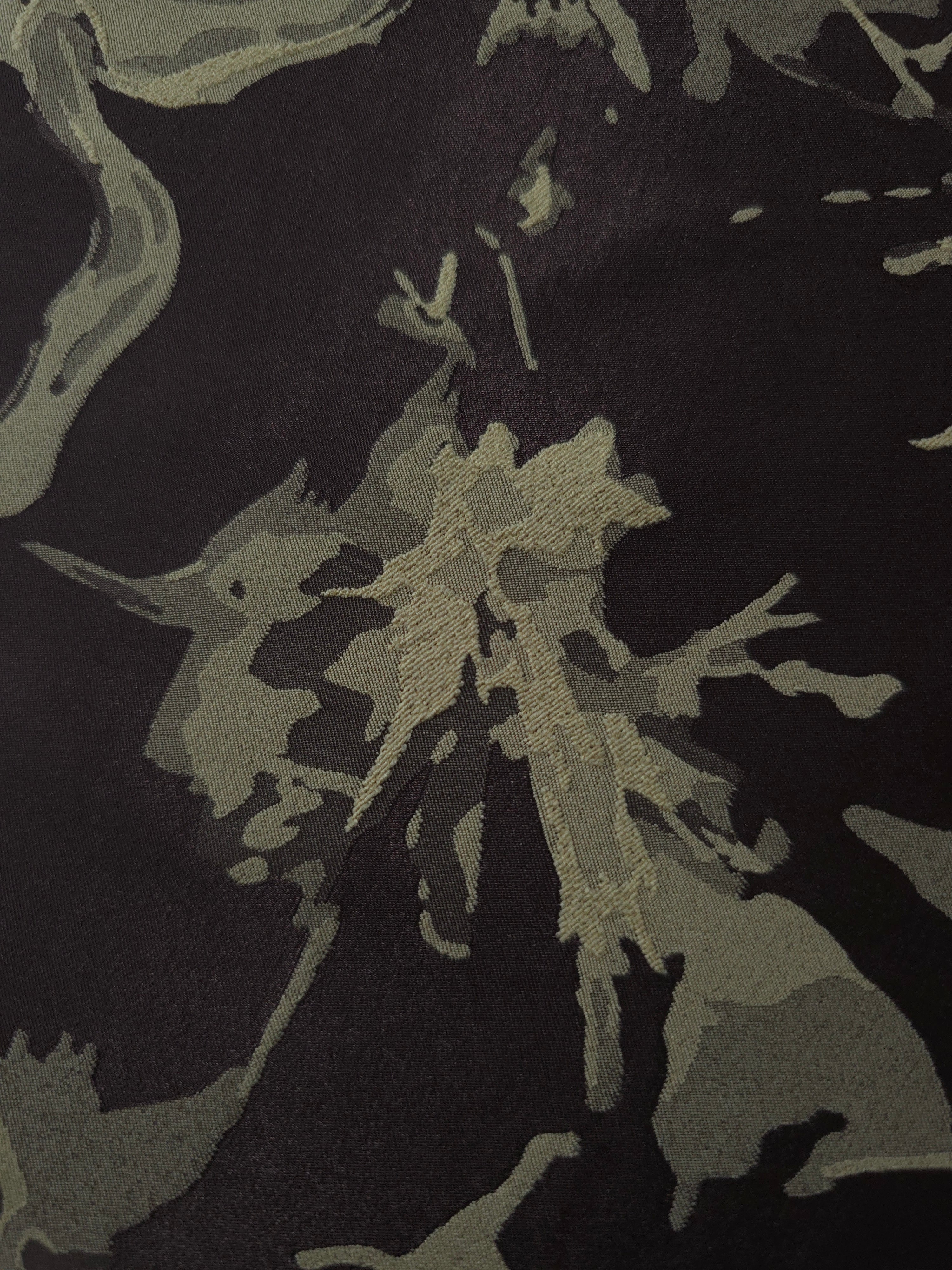 Close-up of the black graphic line colorway, an abstract fractured-splatter motif unlike any other design in this line