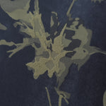 Close-up of the navy-charcoal graphic line colorway, blending cooler and warmer tones in one abstract print
