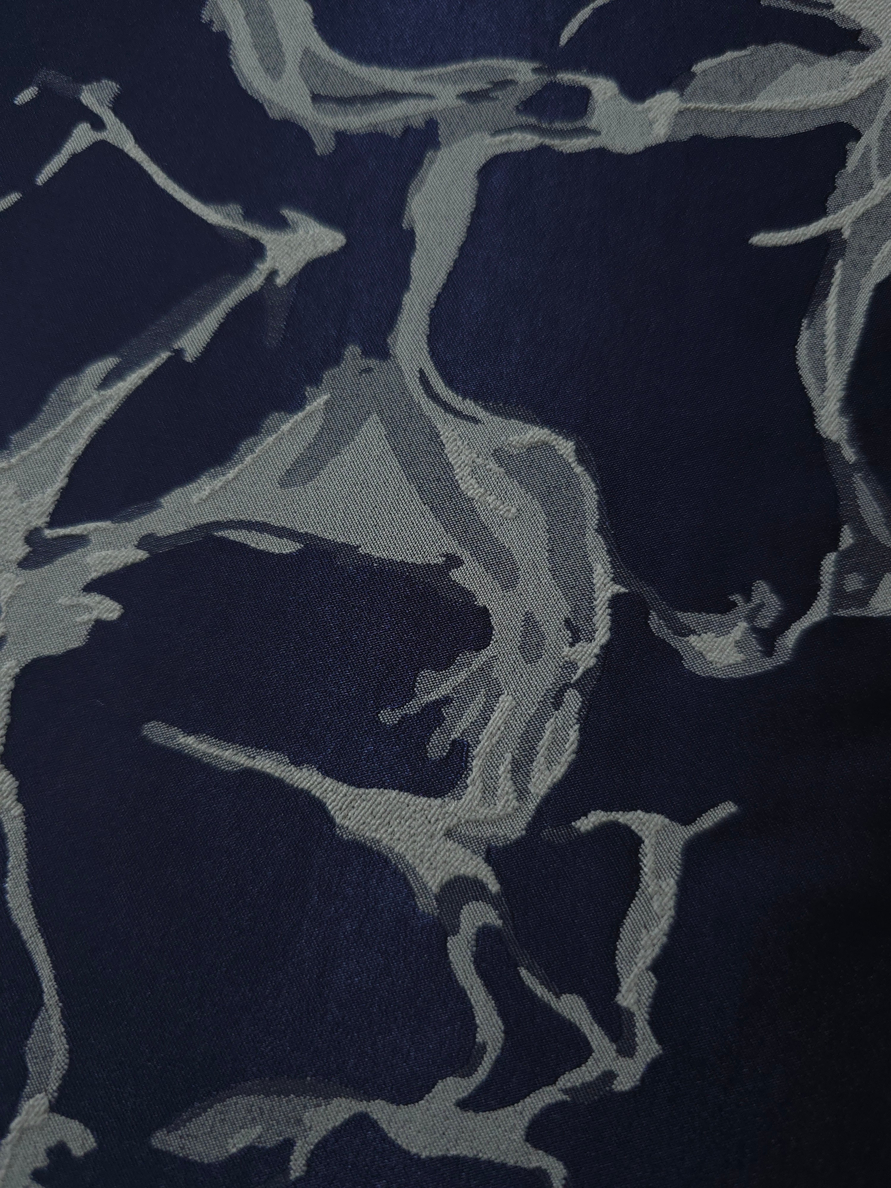 Close detail of the navy graphic line colorway, cooler in tone than the black version