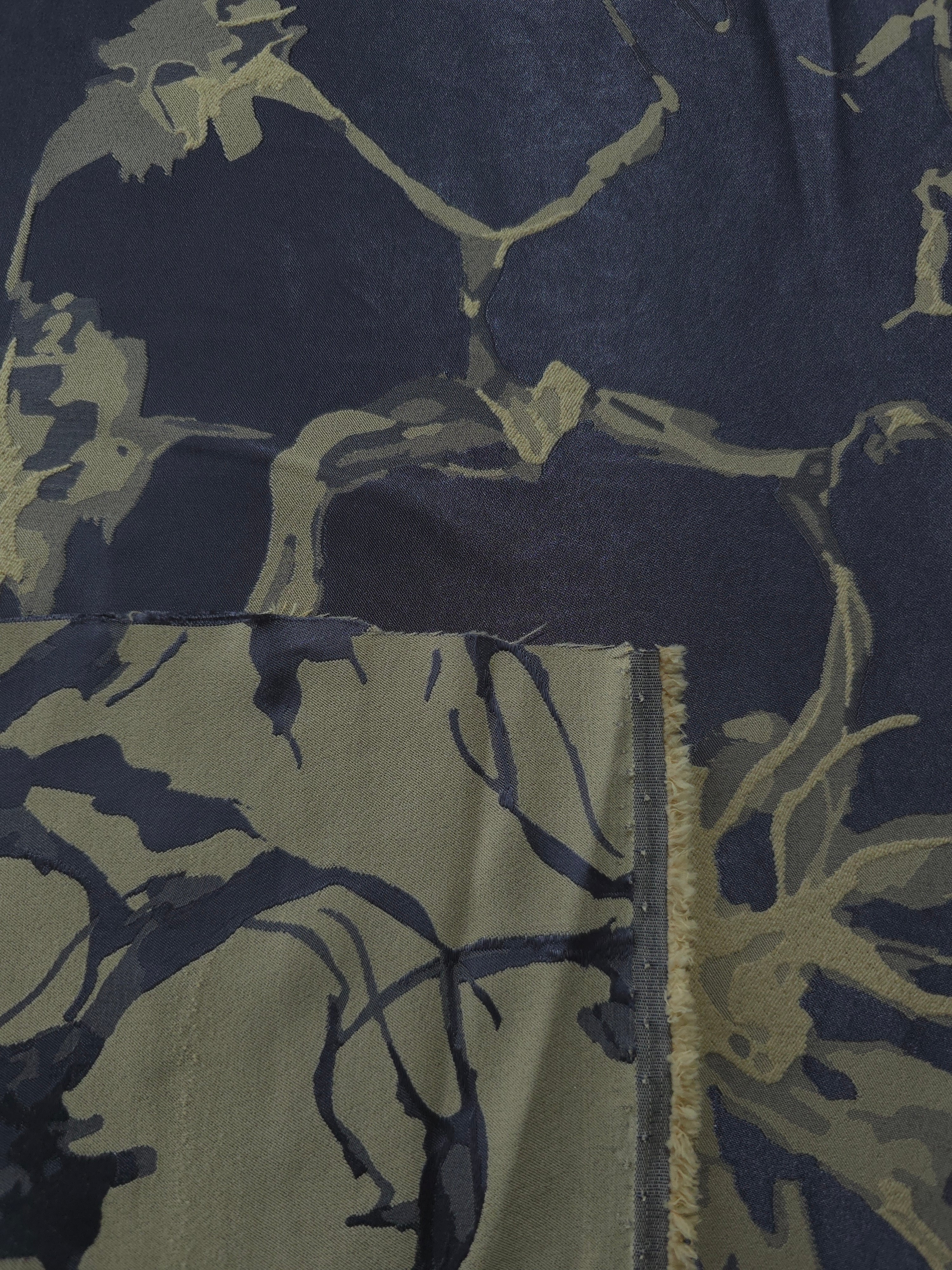 Front and back of the navy-charcoal colorway, the glossy face more saturated than its muted reverse