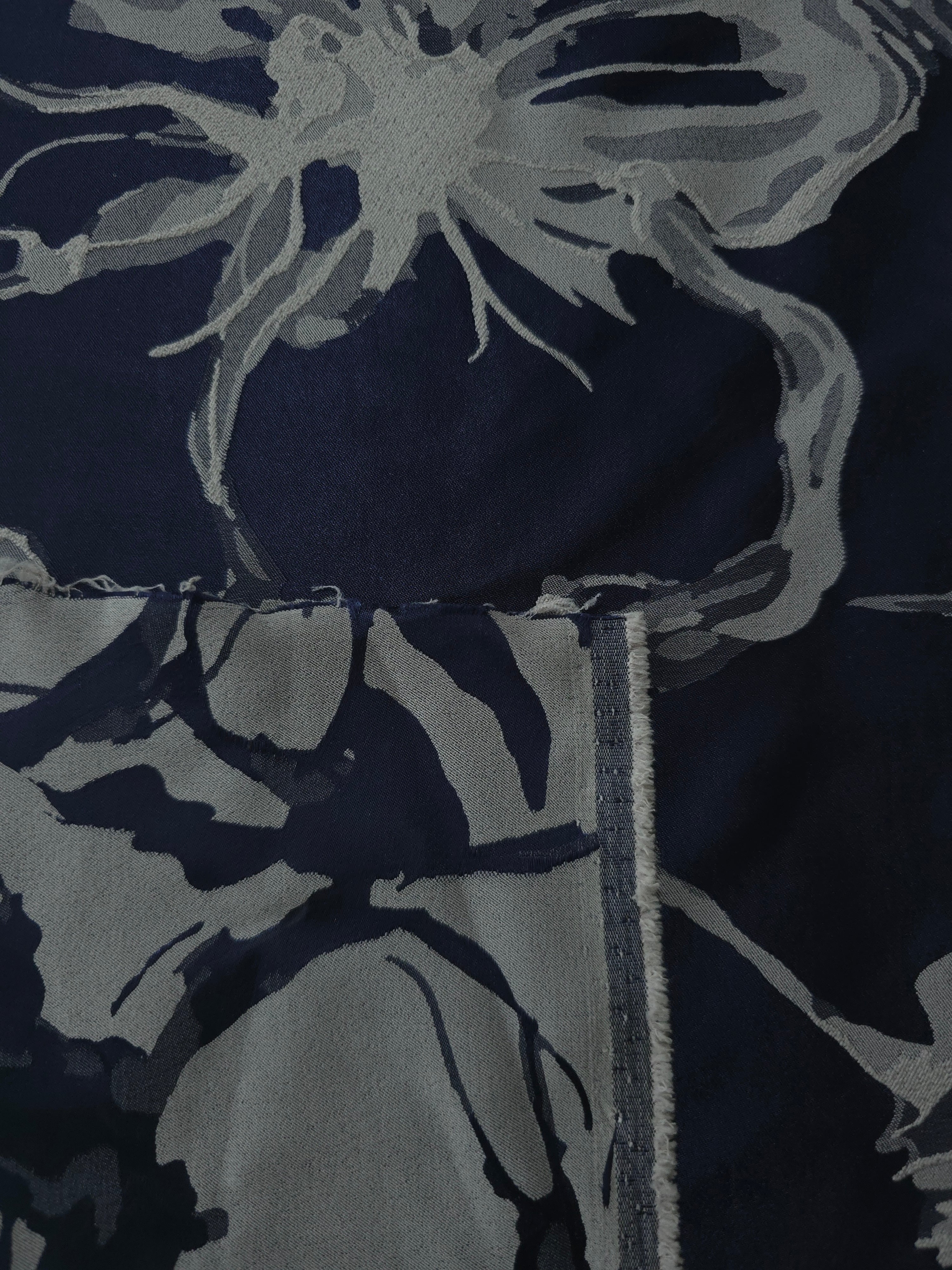 Navy colorway shown front and back, the reverse settling into a softer steel-blue
