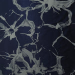 A wider view of the navy and grey-blue graphic line satin laid flat, showing the full abstract repeat