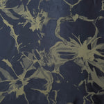 A wider section of the navy-charcoal and olive-tan graphic line satin, shown to judge the abstract pattern at scale