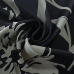 Black hibiscus flower satin draped loosely, suited to buyers wanting a graphic, statement-making floral