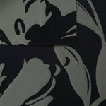 Black colorway shown front and back, the reverse side reading as a softer charcoal