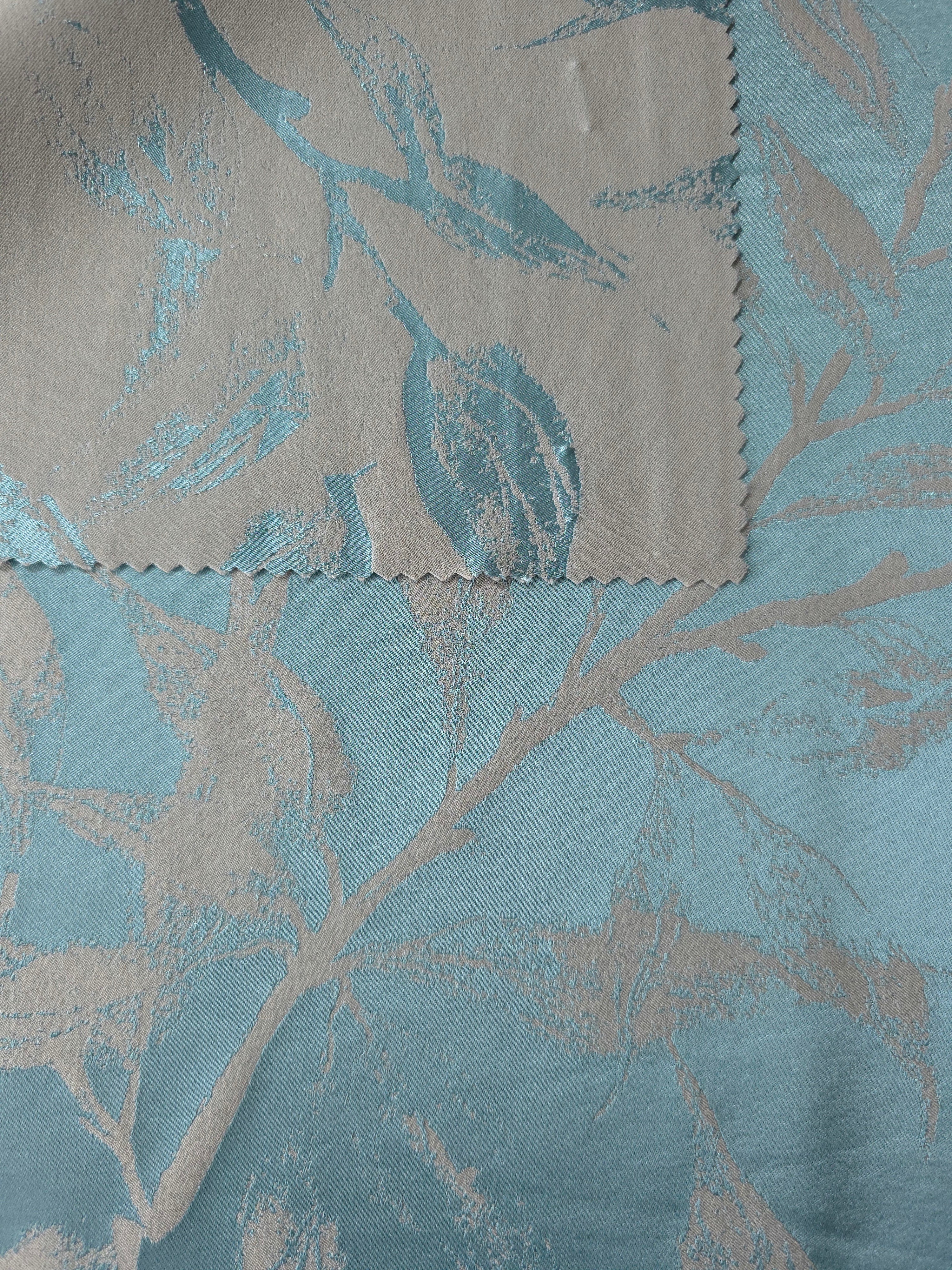 Front and reverse of the teal colorway, the back side settling into a softer seafoam tone