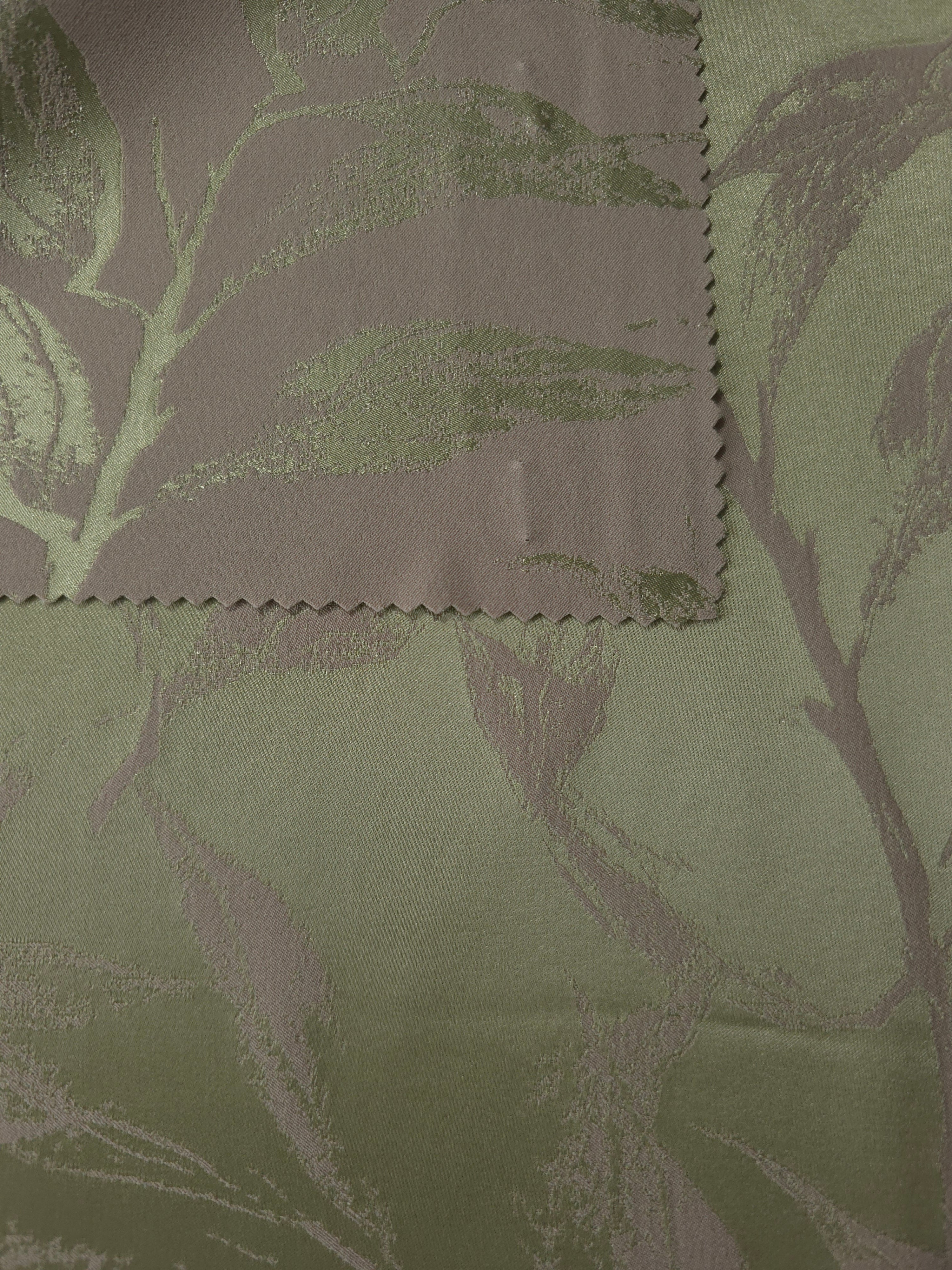 Olive colorway shown front and back, both sides reading close in tone with a subtle sheen shift