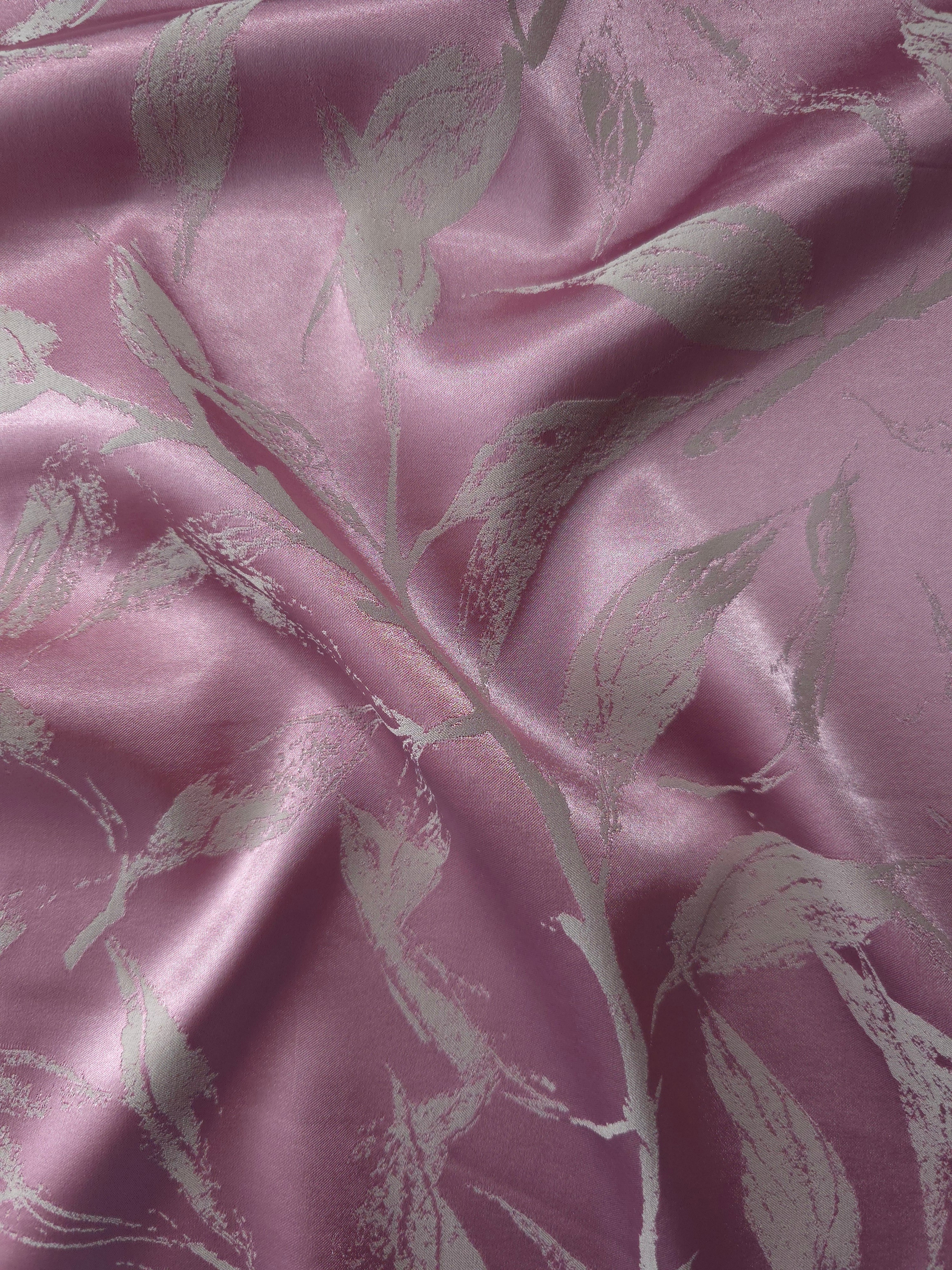 Mauve-plum satin folded over, the grey leaf branches standing out softly against the warm purple base