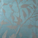 A wider cut of the teal and taupe leaf satin, shown to see the full scale of the branching motif