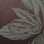 Close-up of the maroon lily flower colorway, the petal detail including a fine speckled texture rather than a flat silhouette