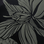 Close detail of the black lily flower colorway, drawn in a finer line-art style than the maroon version