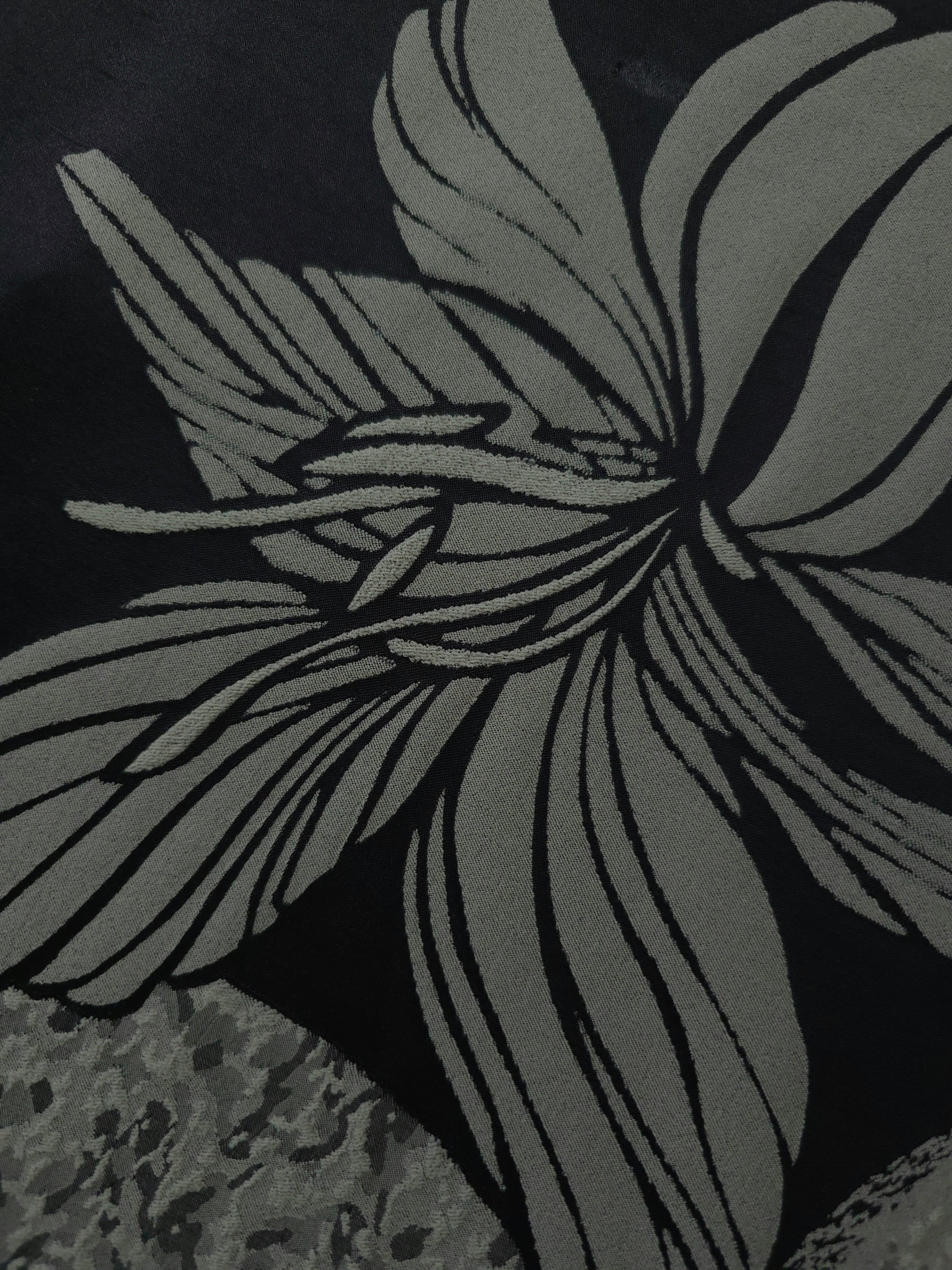 Close detail of the black lily flower colorway, drawn in a finer line-art style than the maroon version
