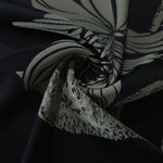 Black lily flower satin draped loosely, suited to buyers wanting a graphic, high-contrast floral