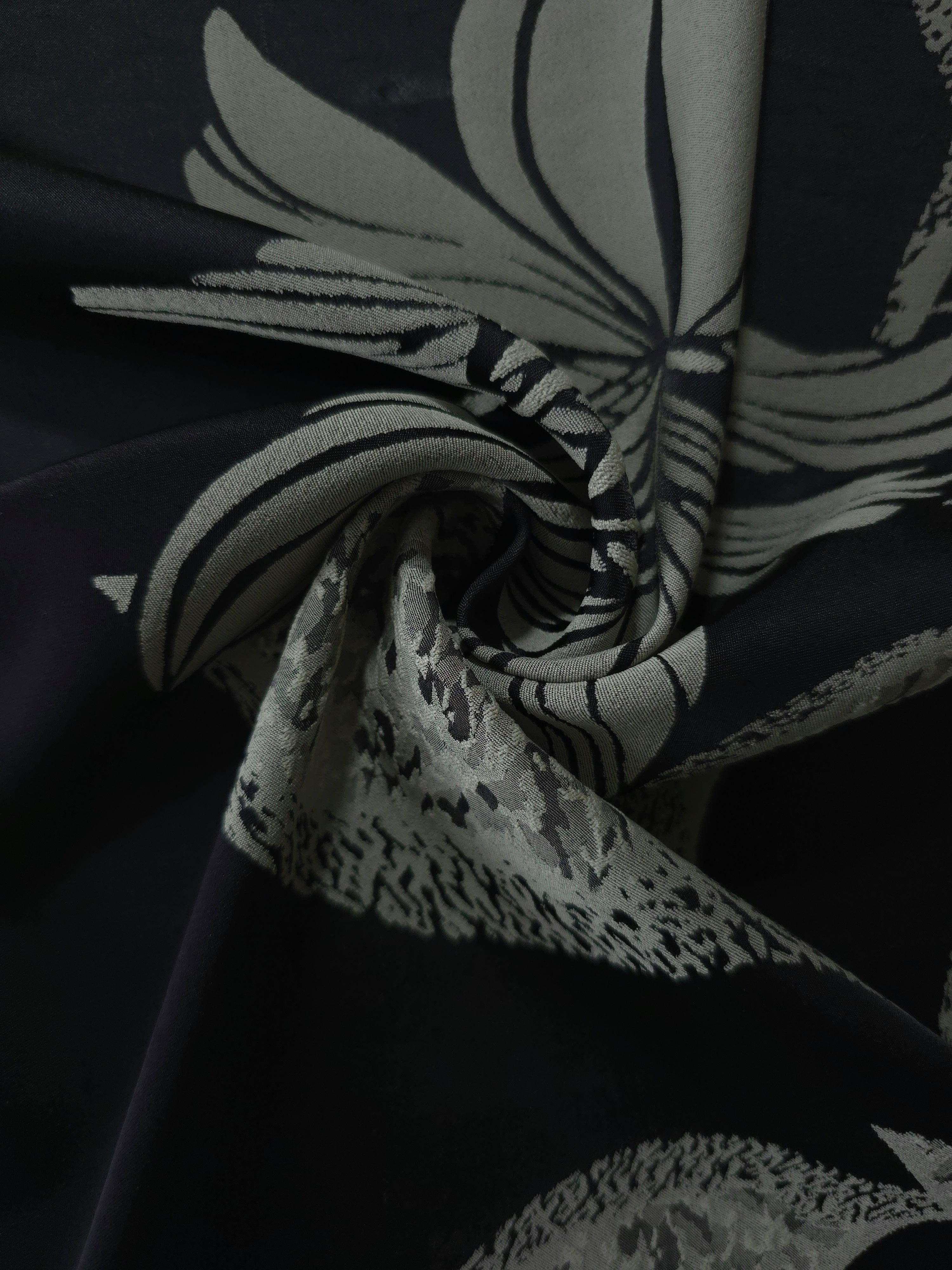 Black lily flower satin draped loosely, suited to buyers wanting a graphic, high-contrast floral