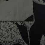 Black colorway shown front and back, the reverse side reading as a deep charcoal rather than true black