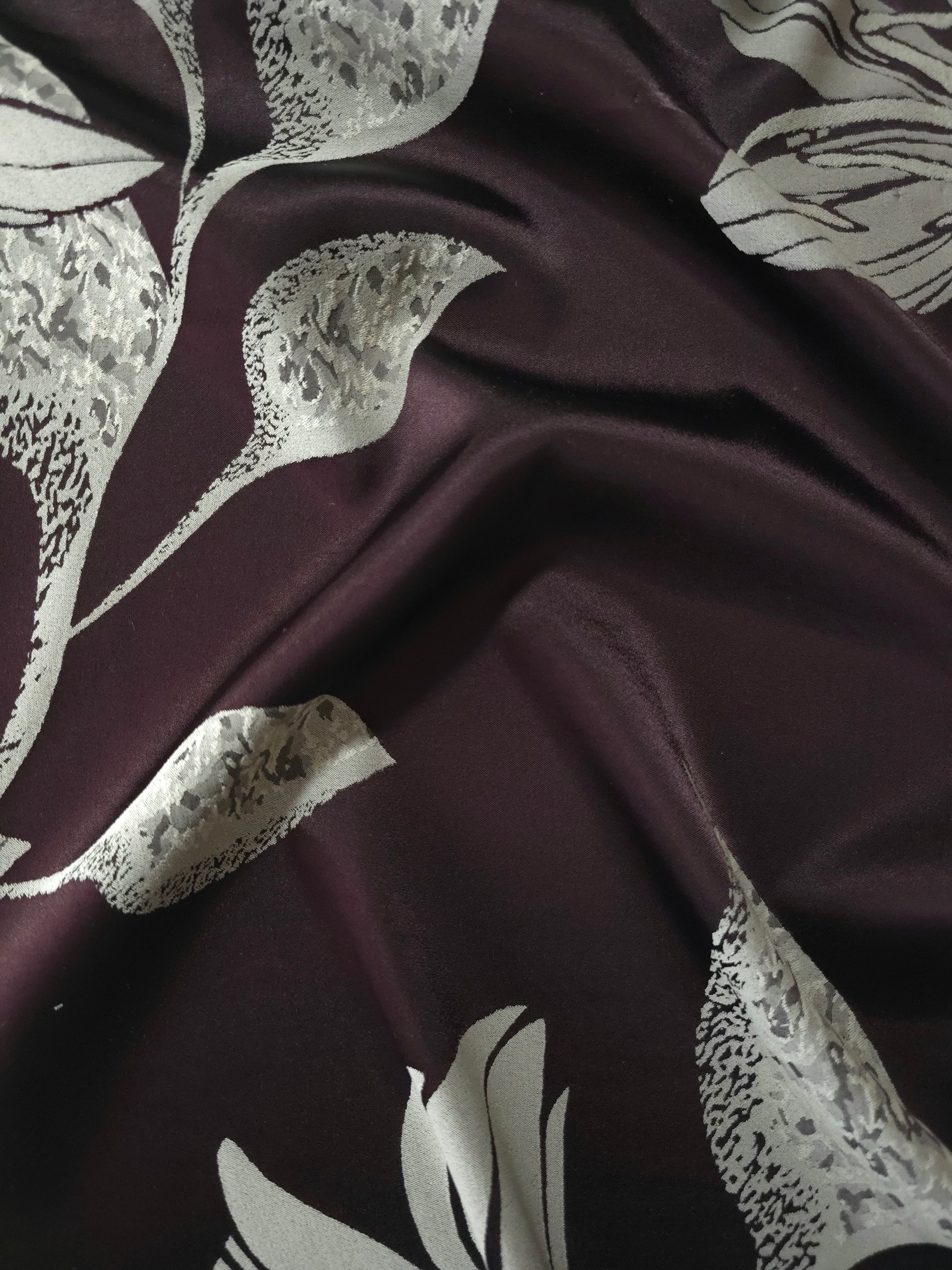 Deep plum satin folded over, the sage lily petals showing the same speckled texture as the maroon colorway in a darker base