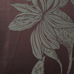 A wider cut of the maroon and sage lily flower satin, shown to see the full scale of the floral motif