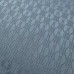 Close-up of the slate blue oval lattice colorway, a geometric repeat rather than a floral or organic motif