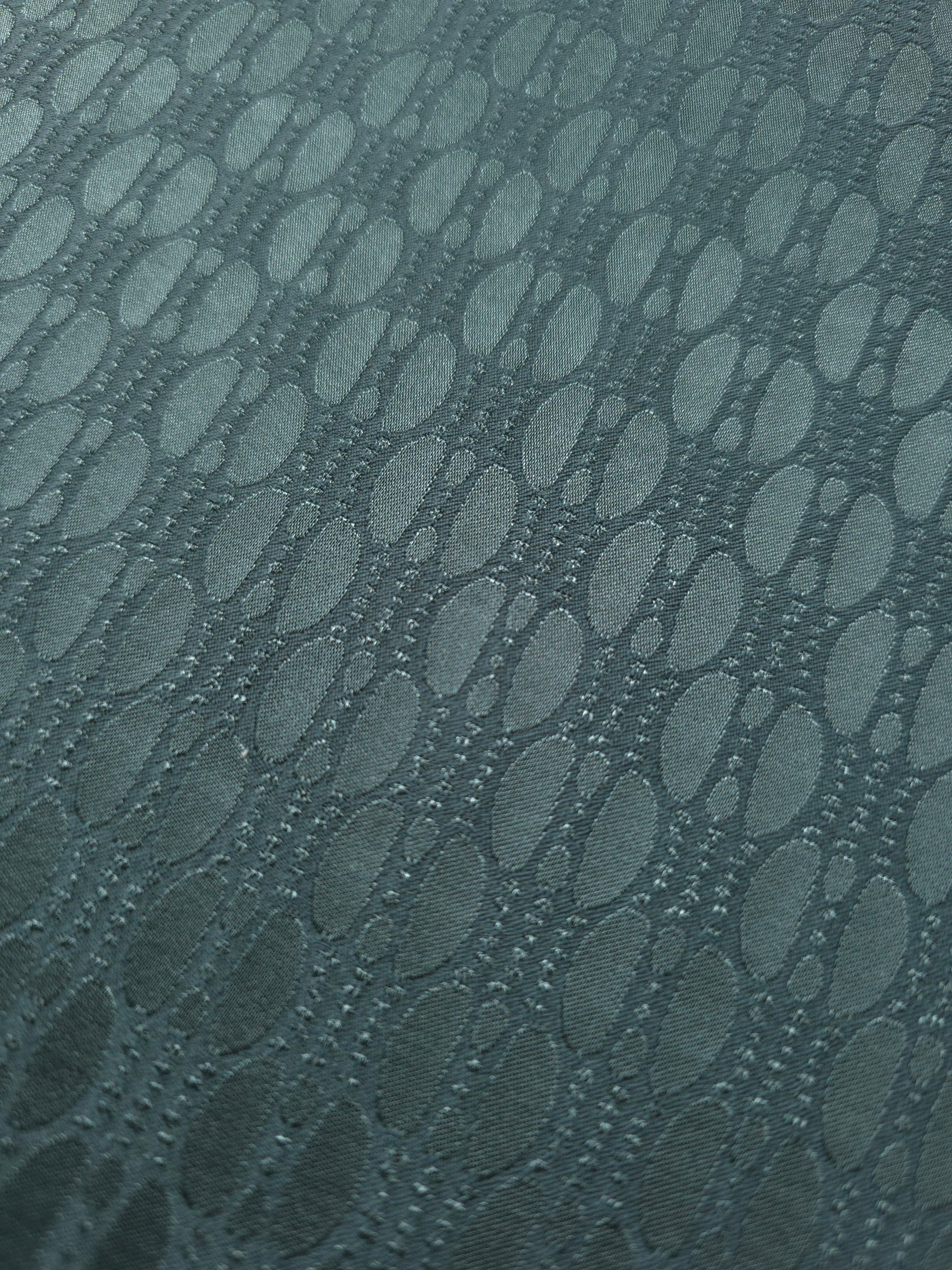 Close-up of the teal-green lattice colorway, the coolest-toned option of the three