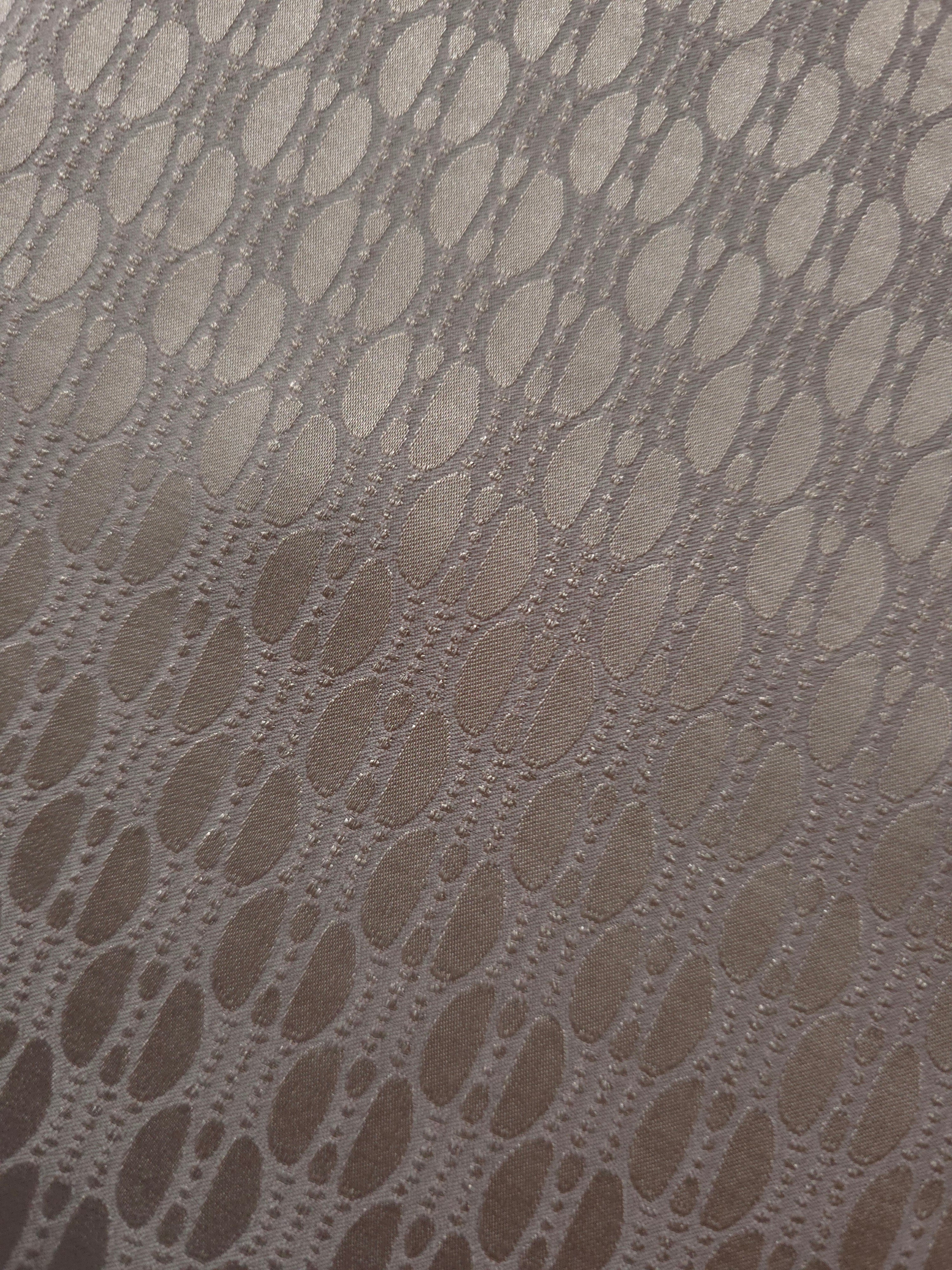 Close detail of the taupe-bronze lattice colorway, suited to buyers wanting a textured neutral
