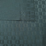 Front and back of the teal-green colorway, the glossy face slightly more saturated than its reverse