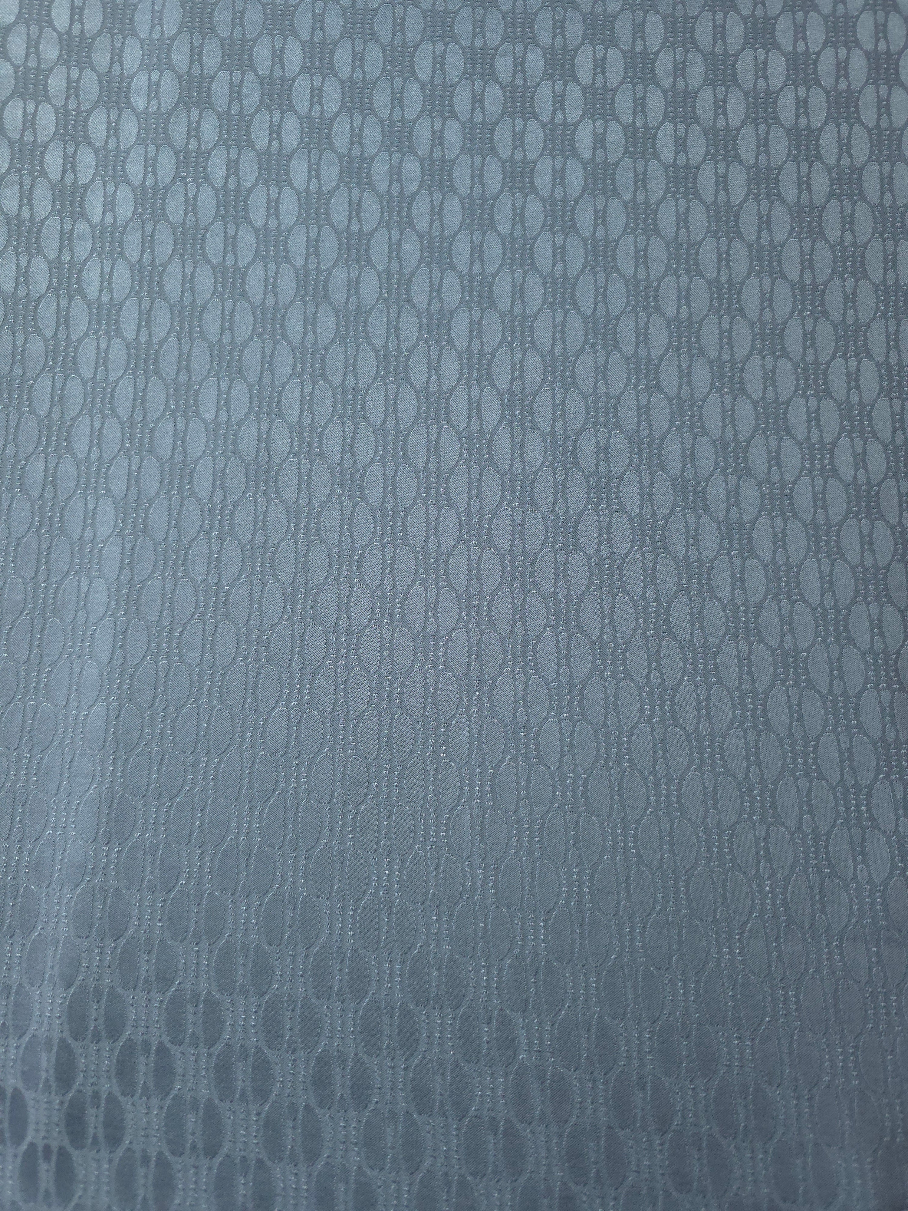 A wider cut of the slate blue oval lattice satin, shown to see the full scale of the geometric repeat