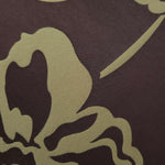 Close-up of the aubergine and sage pansy flower colorway, a high-contrast floral rather than the tonal motifs in this line