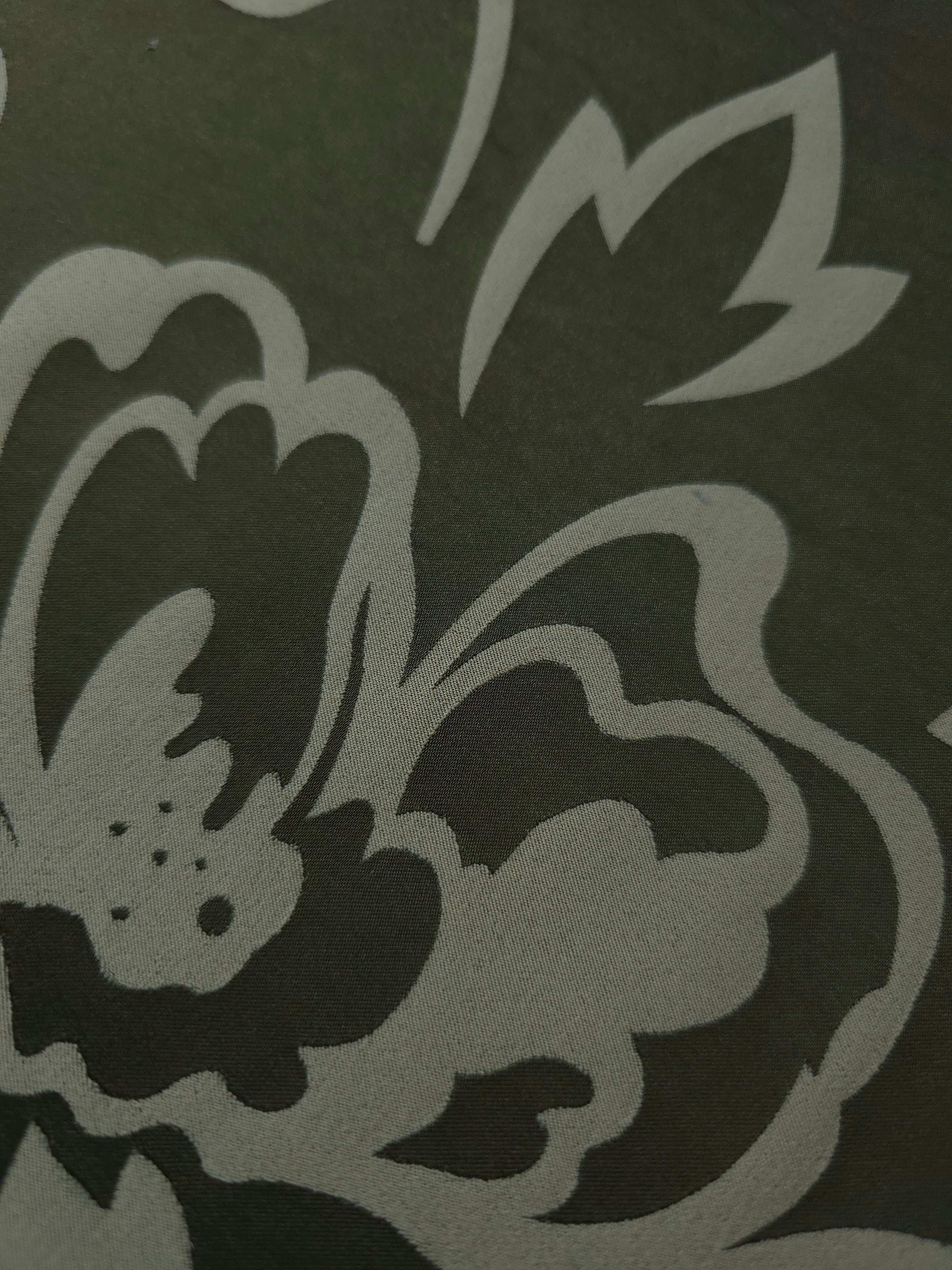 Close detail of the forest green pansy flower colorway, deeper and more dramatic than the aubergine version