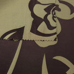 Front and back of the aubergine colorway, the glossy face far more saturated than its muted reverse