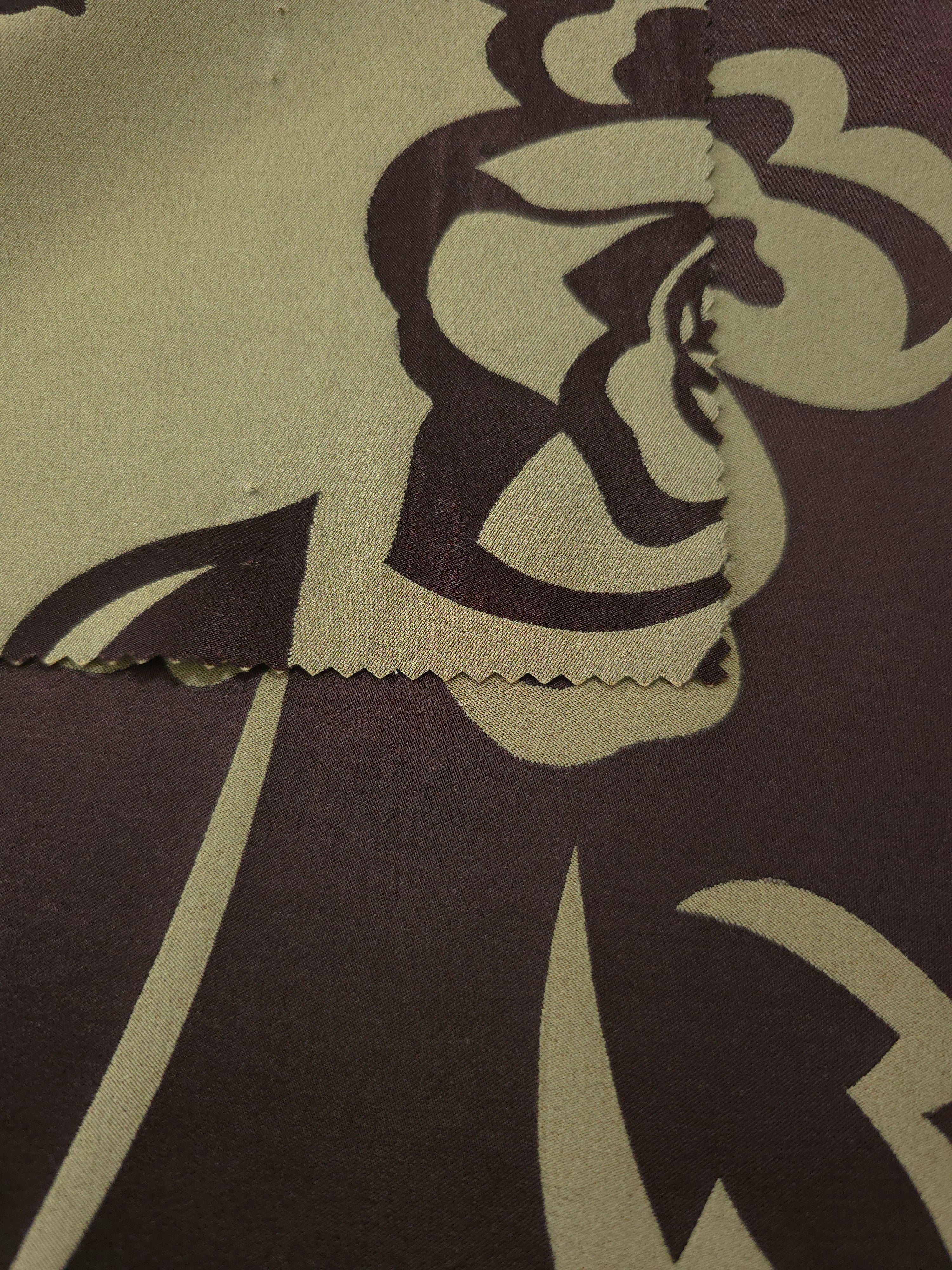 Front and back of the aubergine colorway, the glossy face far more saturated than its muted reverse