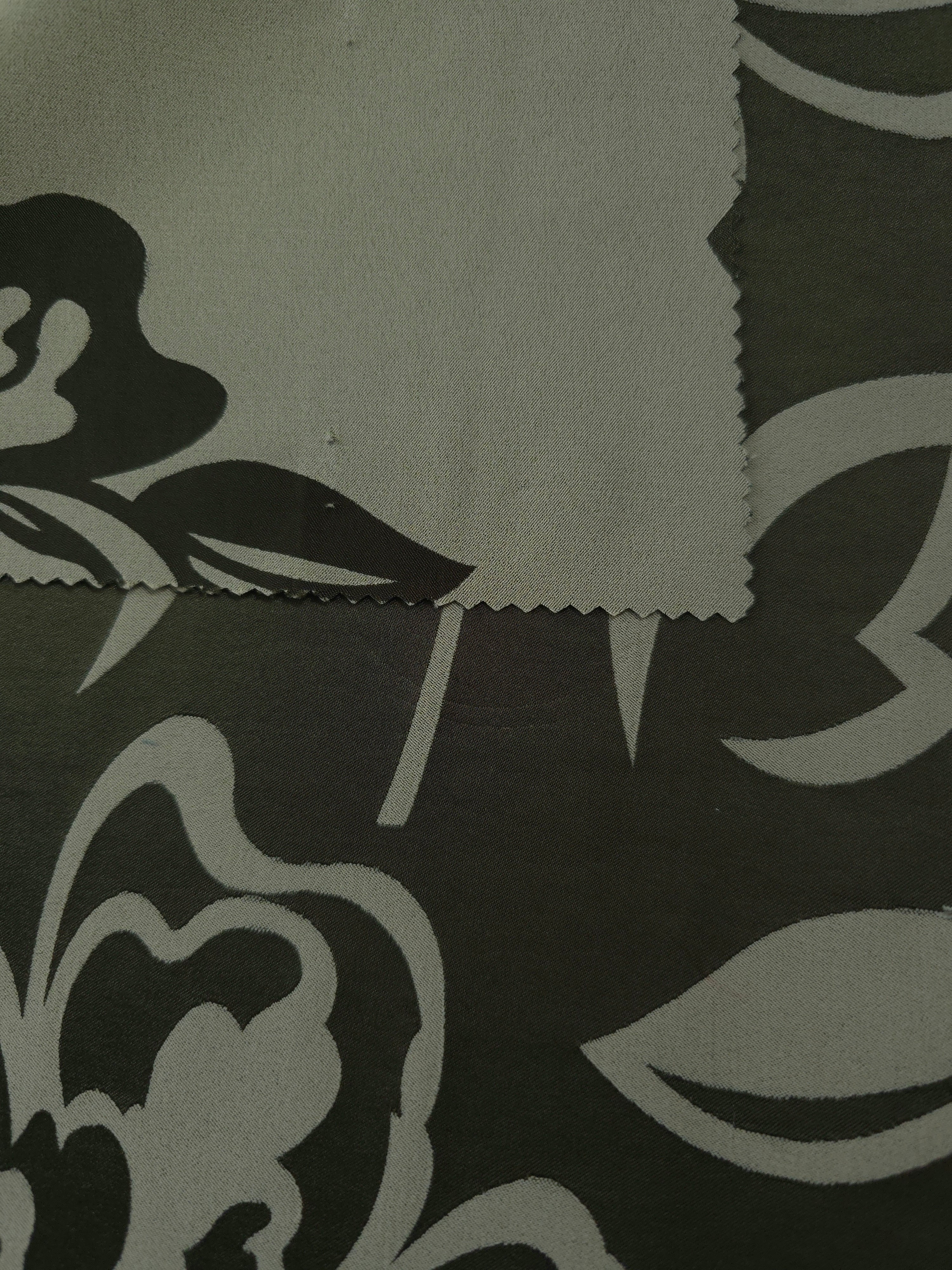 Forest green colorway shown front and back, the reverse settling into a quieter olive tone