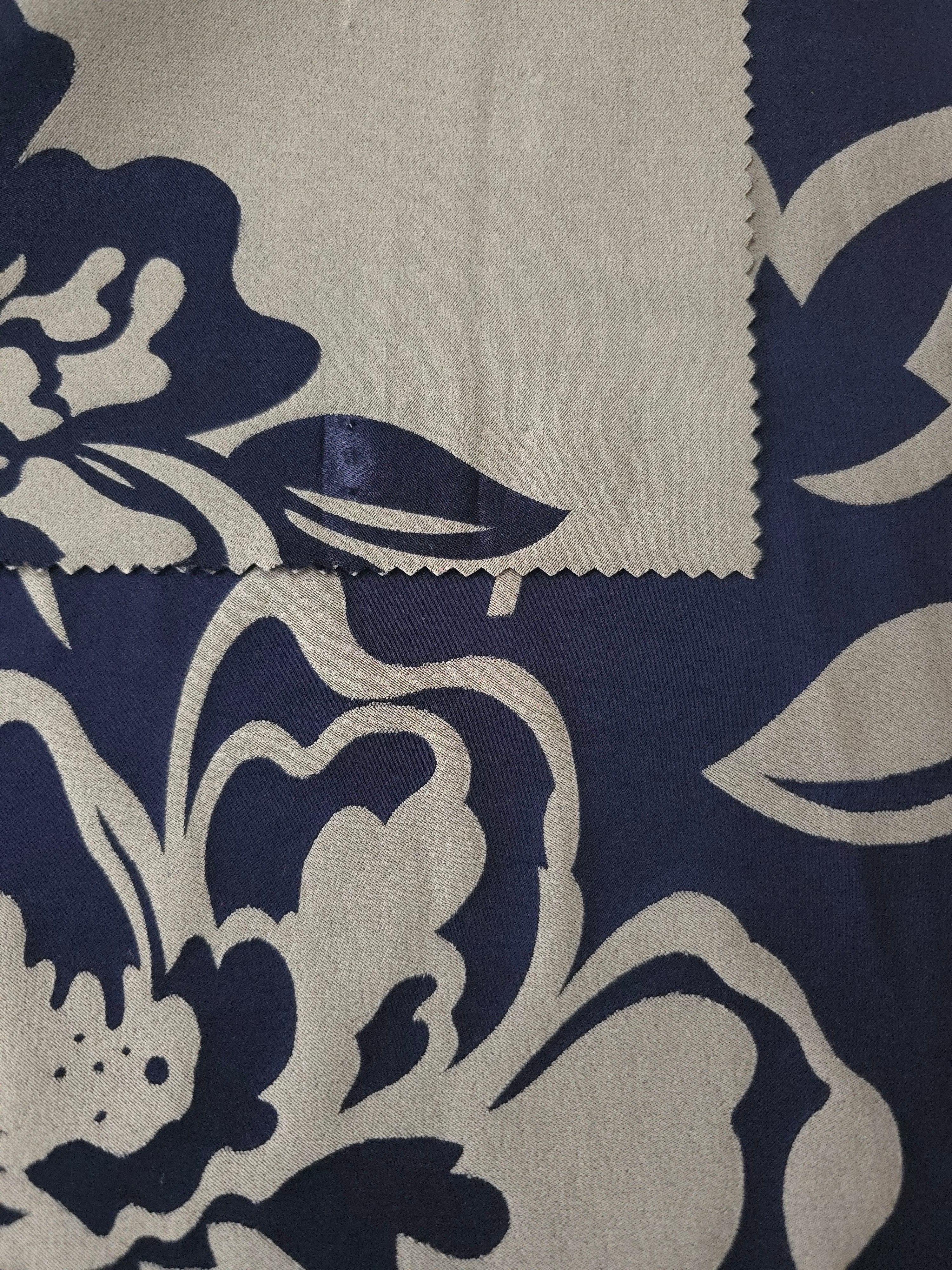 Front and back of the navy colorway, the glossy face holding a deeper blue than its softer reverse