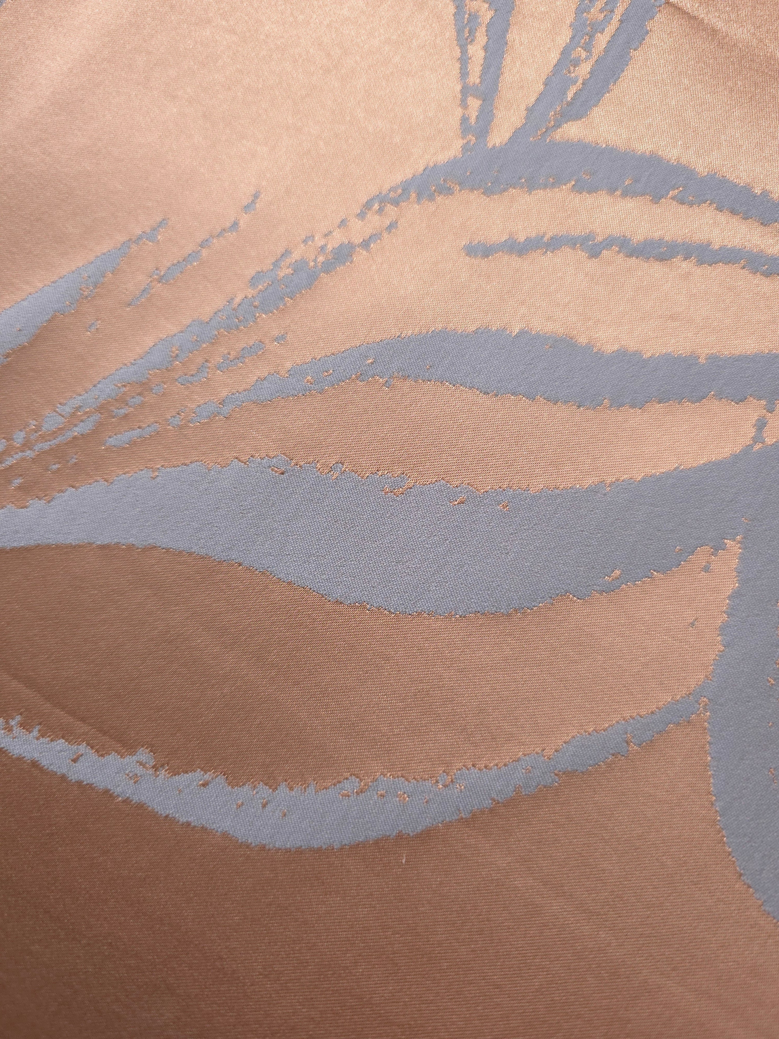 Close-up of the copper and blue-grey colorway, the combination shown in the original product photography for this fabric