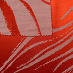 Front and back of the orange-red colorway, the glossy face far more saturated than its muted reverse