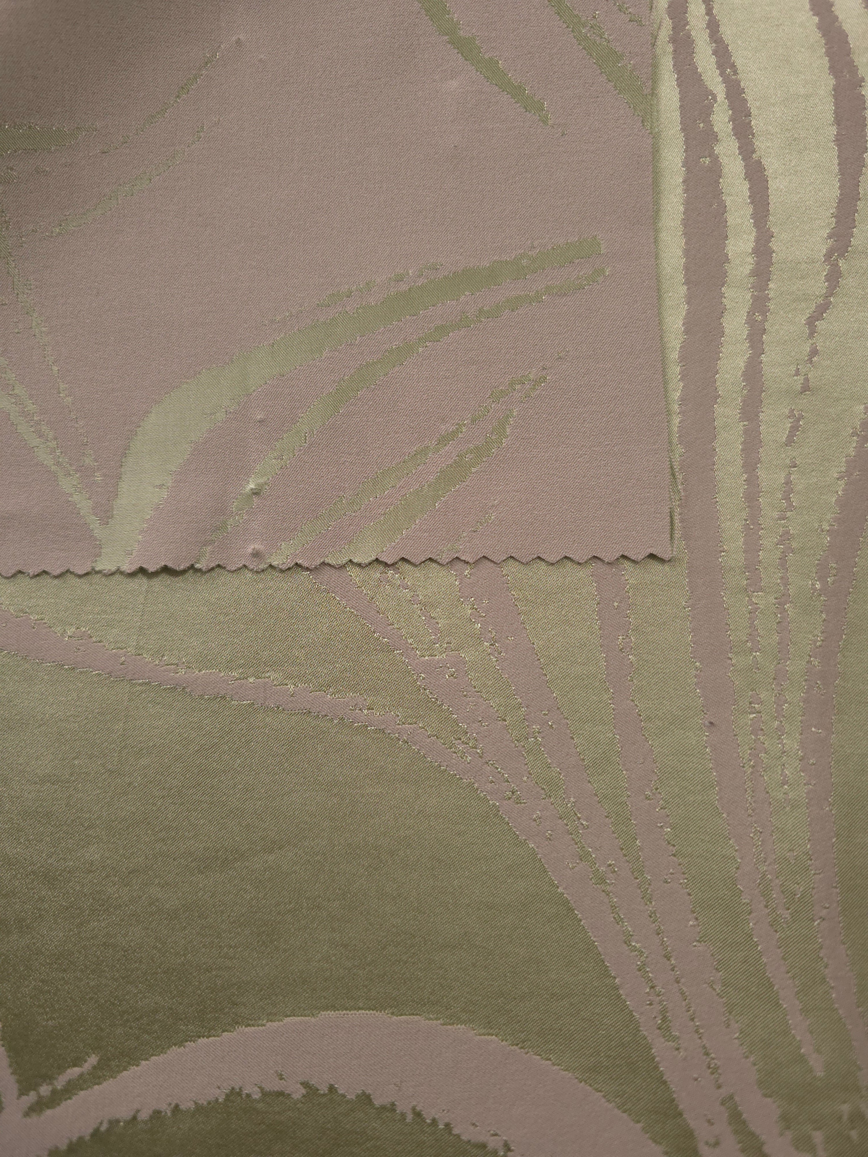 Sage colorway shown front and back, the reverse side shifting toward a deeper olive tone