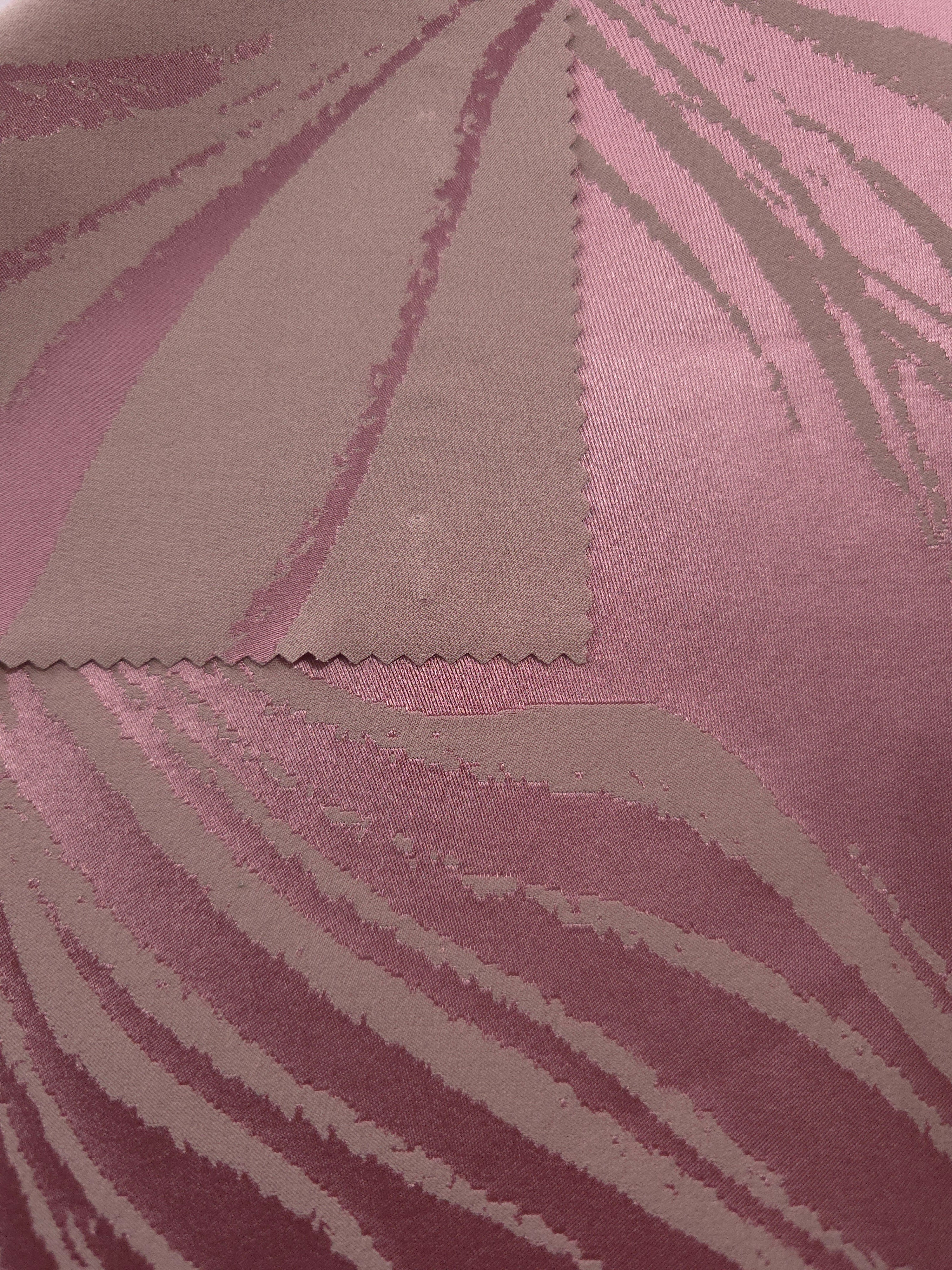 Magenta colorway shown front and back, the reverse side noticeably more muted than the glossy face