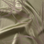 Sage green satin folded over, with mauve seaweed lines crossing through the muted green-grey base