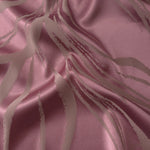 Magenta satin gathered into a fold, with taupe seaweed lines running through the brighter pink tone