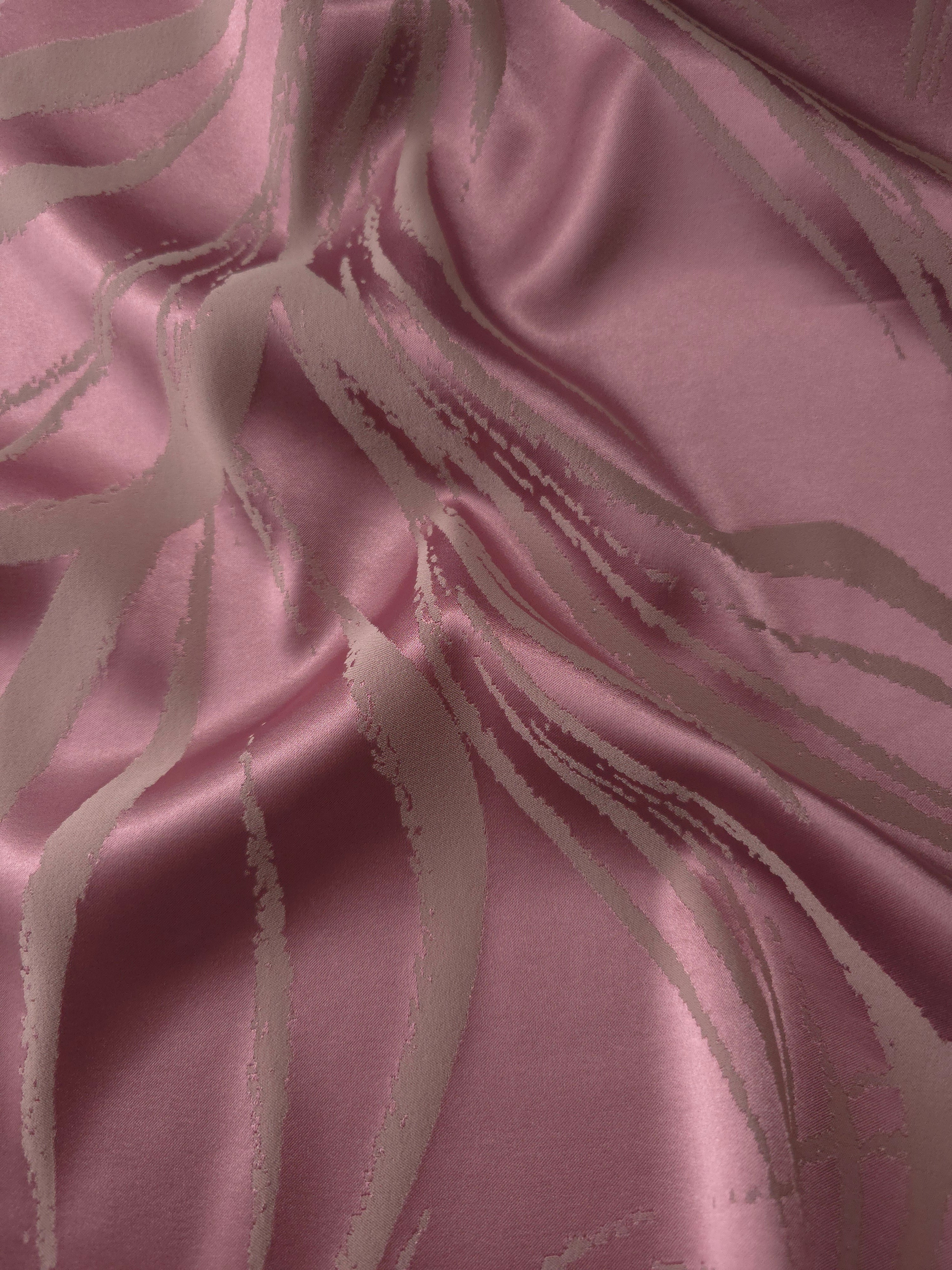 Magenta satin gathered into a fold, with taupe seaweed lines running through the brighter pink tone