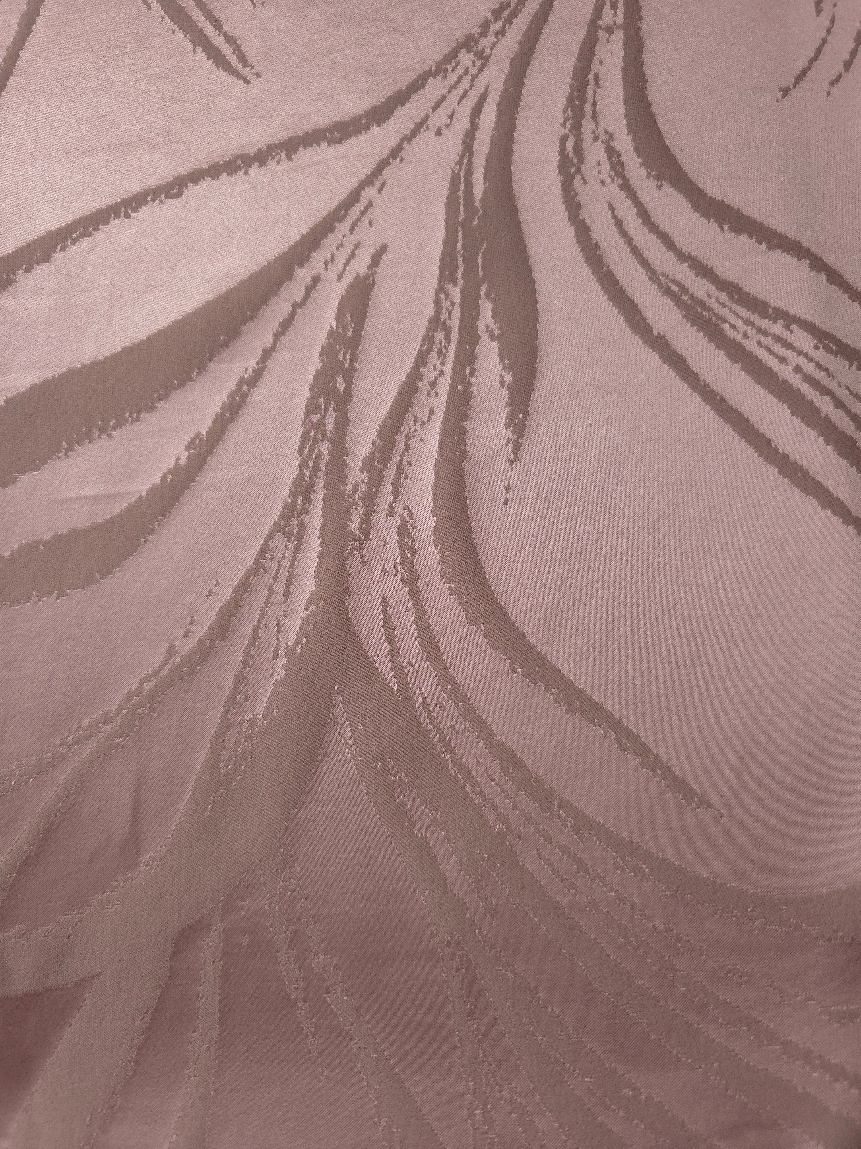 A wider cut of dusty rose seaweed-pattern satin laid flat, useful for judging the overall scale of the print