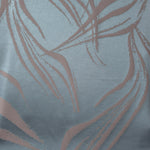 Full width of the slate blue and mauve seaweed satin, shown unfolded to see the repeat of the motif
