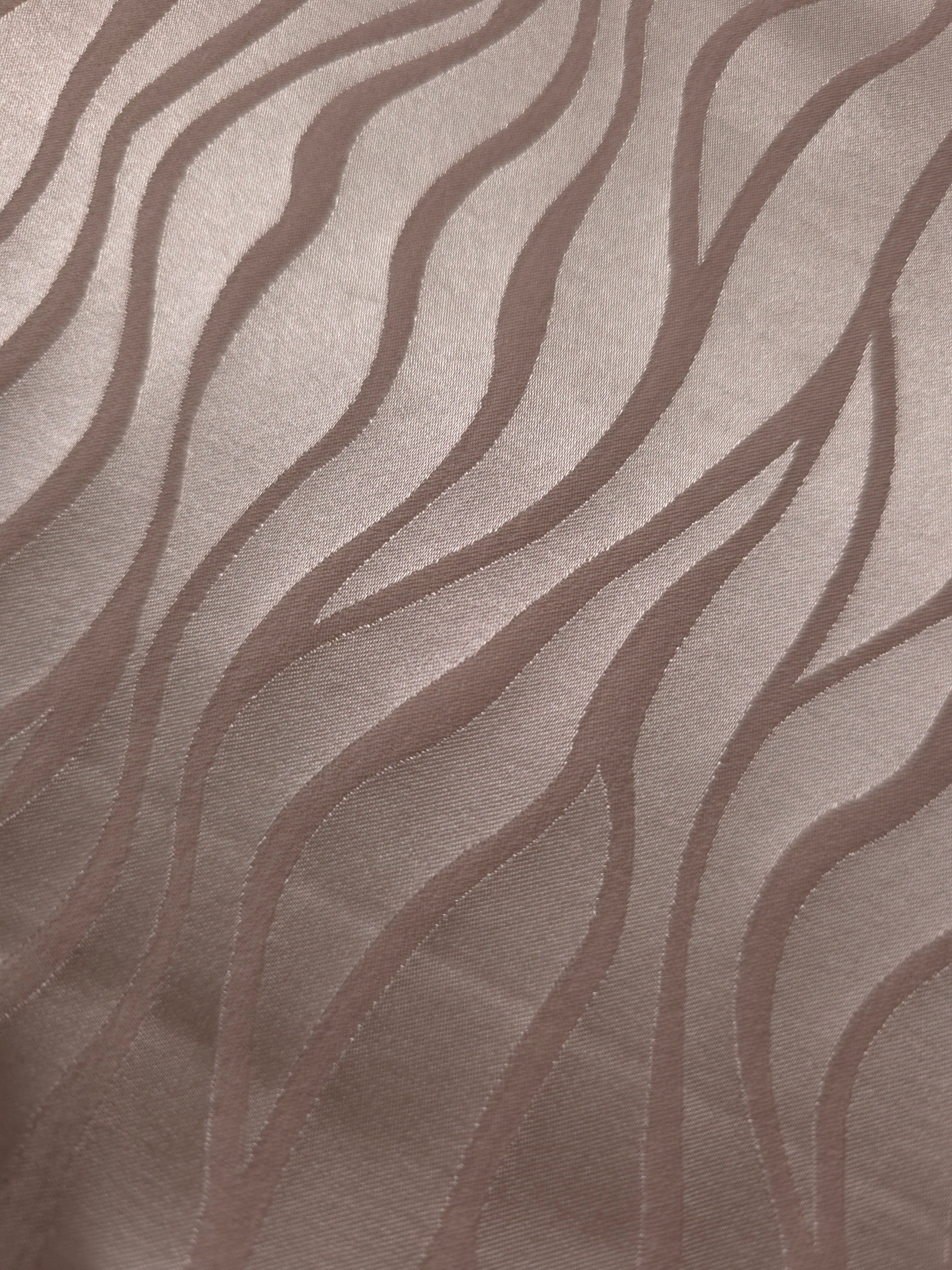 Close detail of the tonal taupe wave colorway, one of the more understated options in this fabric line