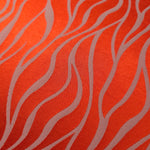 Close-up of the orange-red wave colorway, the highest-contrast option in this fabric's color range