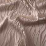 Taupe-grey satin folded softly, the wave motif reading almost entirely through sheen since the colorway is tonal