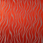 A wider section of the orange-red and ivory wave satin, shown to give a sense of the full pattern at scale