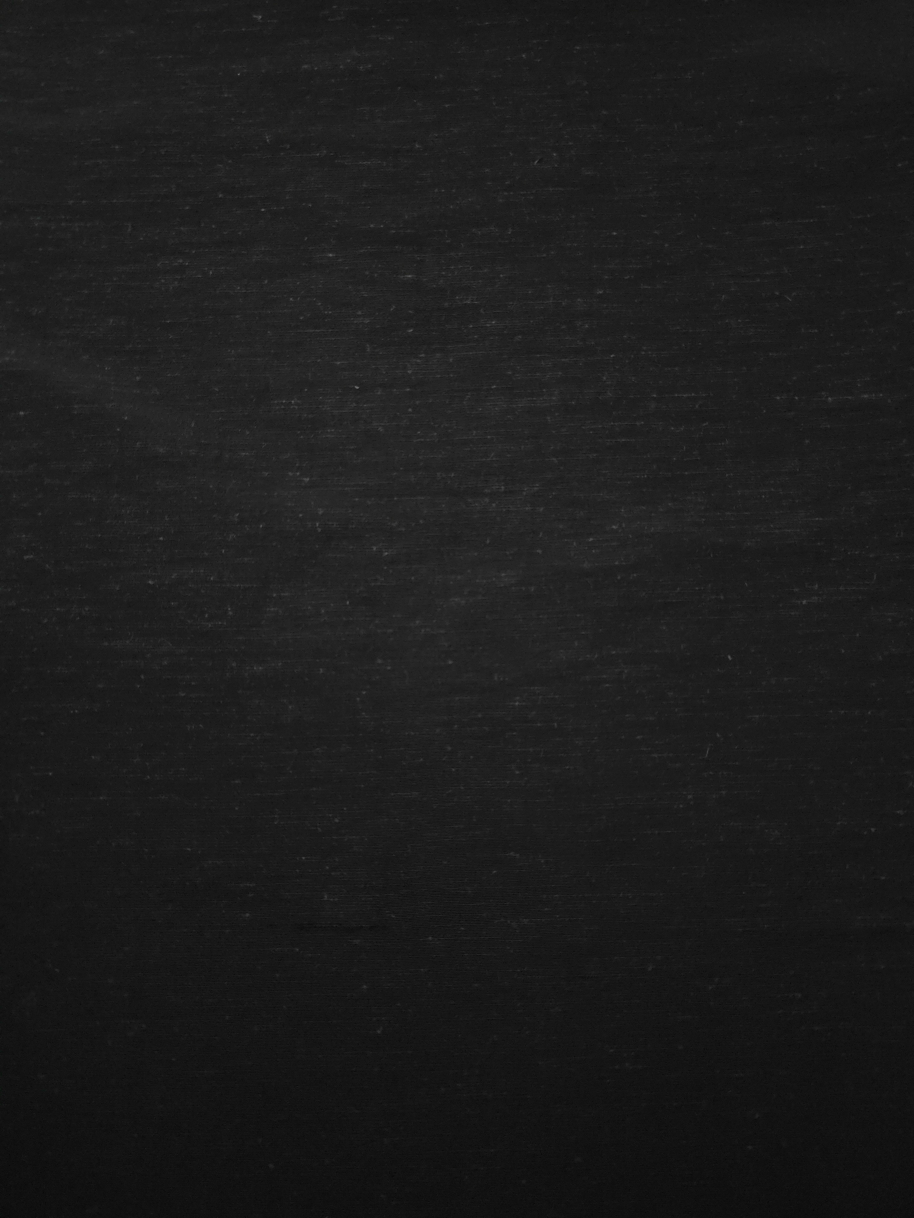 Deep black linen viscose plain fabric with a smooth, breathable weave suited for warm-weather apparel.