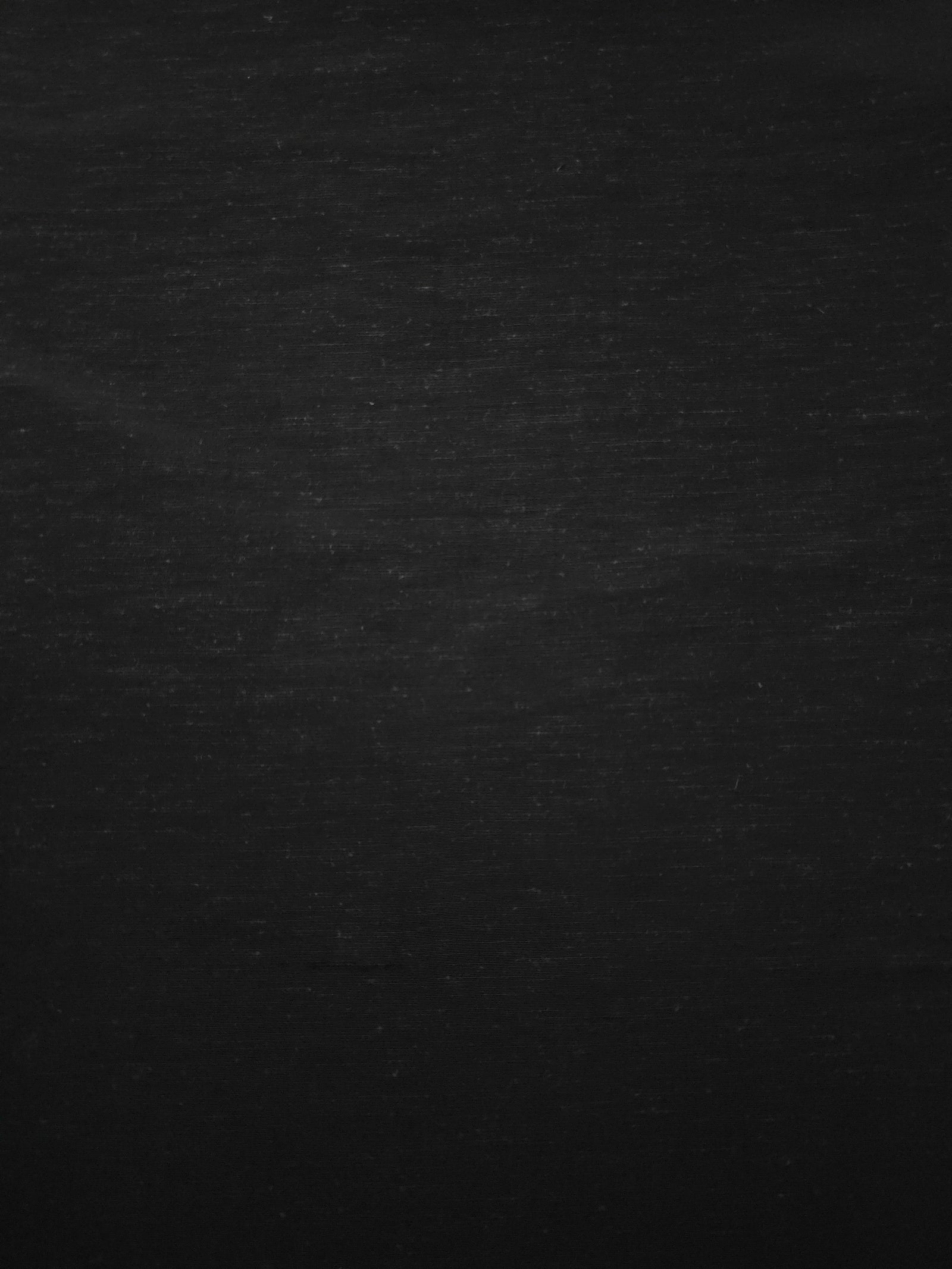 Deep black linen viscose plain fabric with a smooth, breathable weave suited for warm-weather apparel.