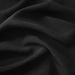 Deep black linen viscose plain fabric styled for modestwear, with a matte, soft-touch finish.
